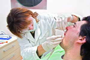 Dentist examining a patient